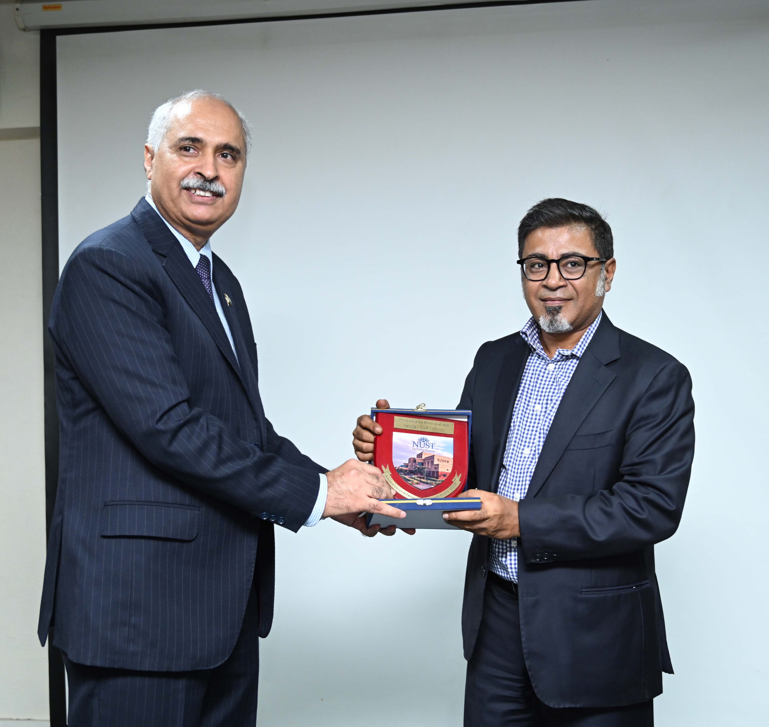 Mr. Raihan Merchant TI, CEO Z2C Ltd., receives a token of thanks from Dr. Muhammad Ajmal Khan, SI(M) Principal SEECS NUST