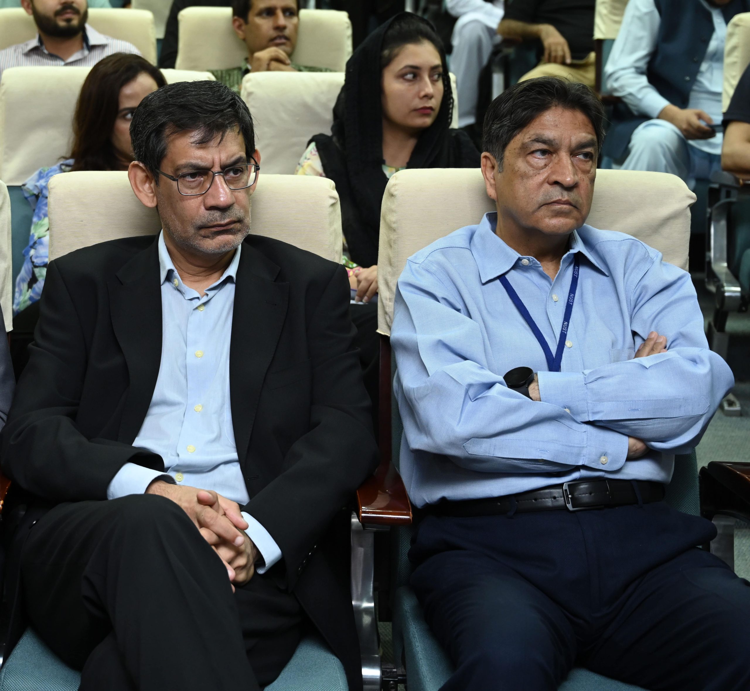 Faculty and guests listen to presentations