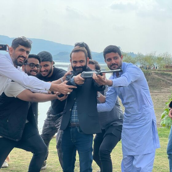 Team Walee supporting fellow member in his turn at shooting